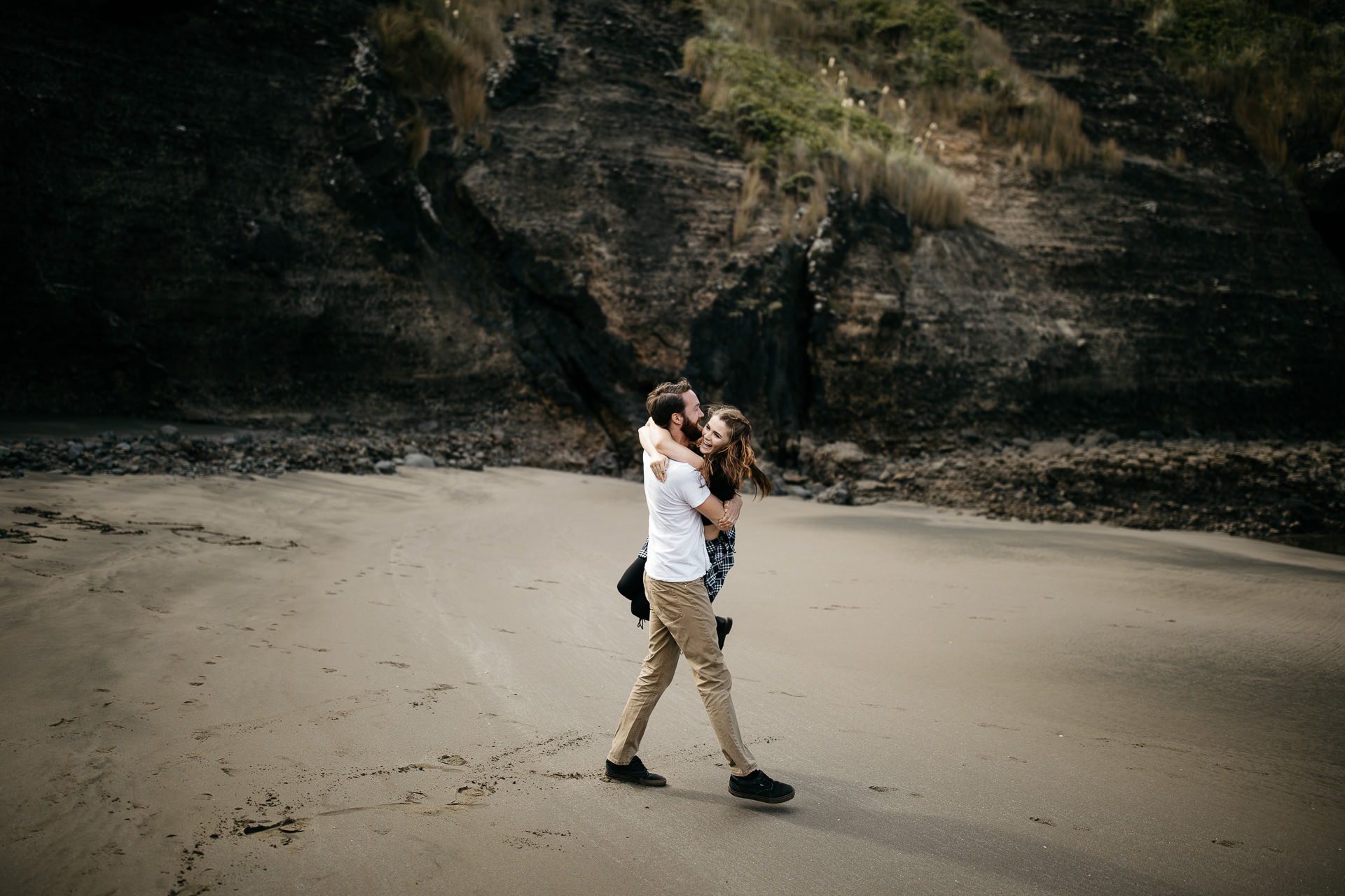 Amy & Daniel Piha Beach Engagement New Zealand by Jean-Laurent Gaudy