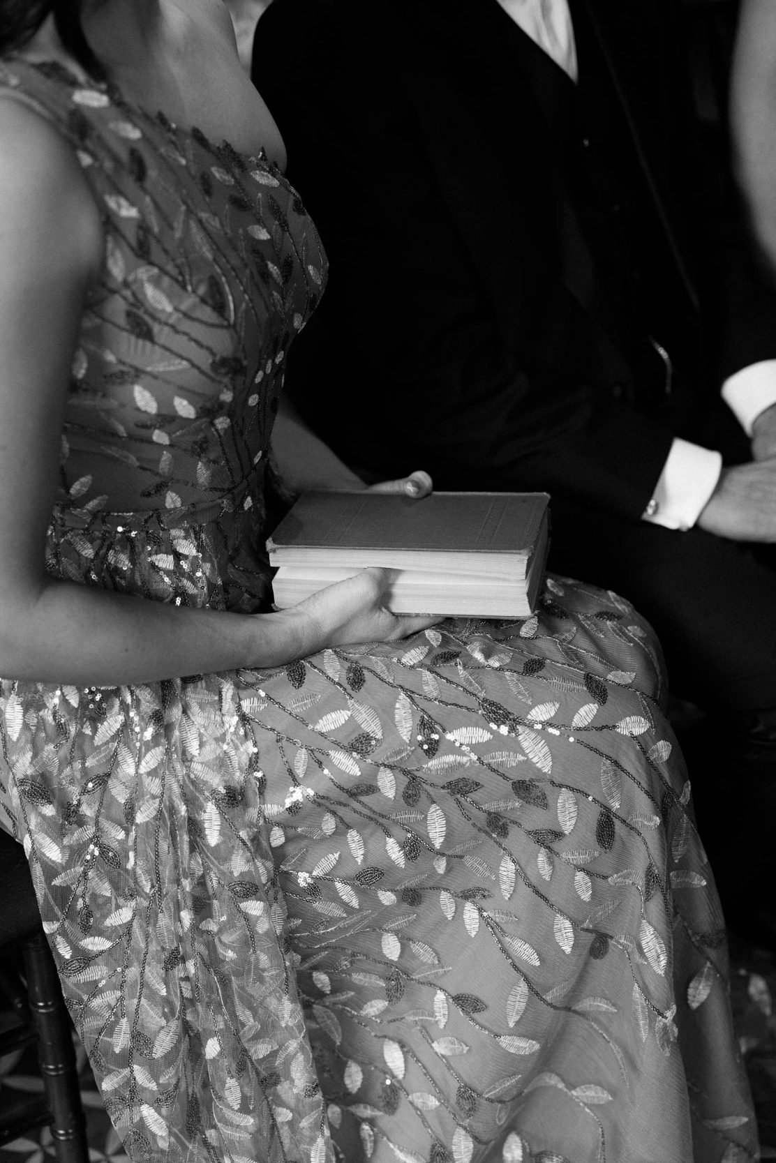 A stylish New York City wedding, rustic brick walls, velvet drapery, and golden candlelight, capturing the intimate, cinematic atmosphere of the iconic venue.