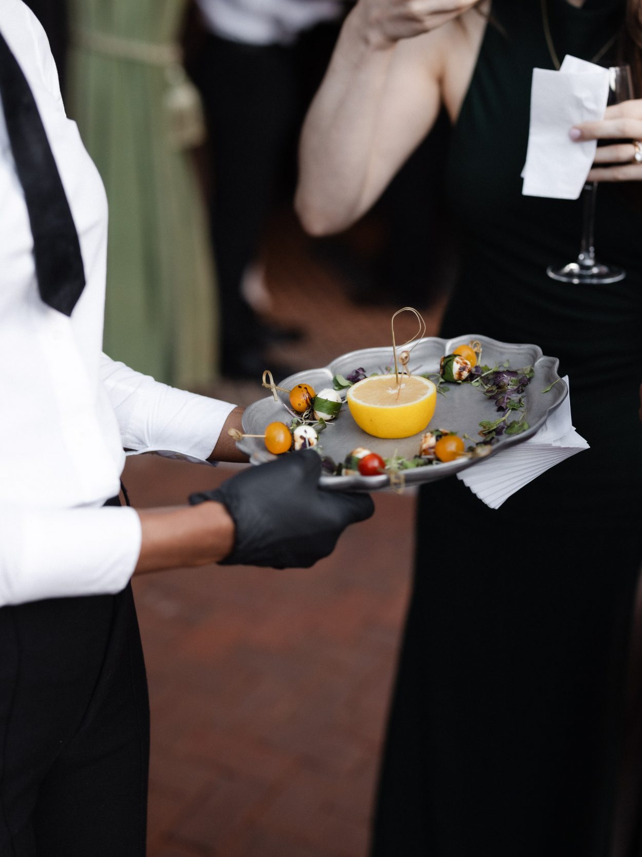 A stylish New York City wedding, rustic brick walls, velvet drapery, and golden candlelight, capturing the intimate, cinematic atmosphere of the iconic venue.