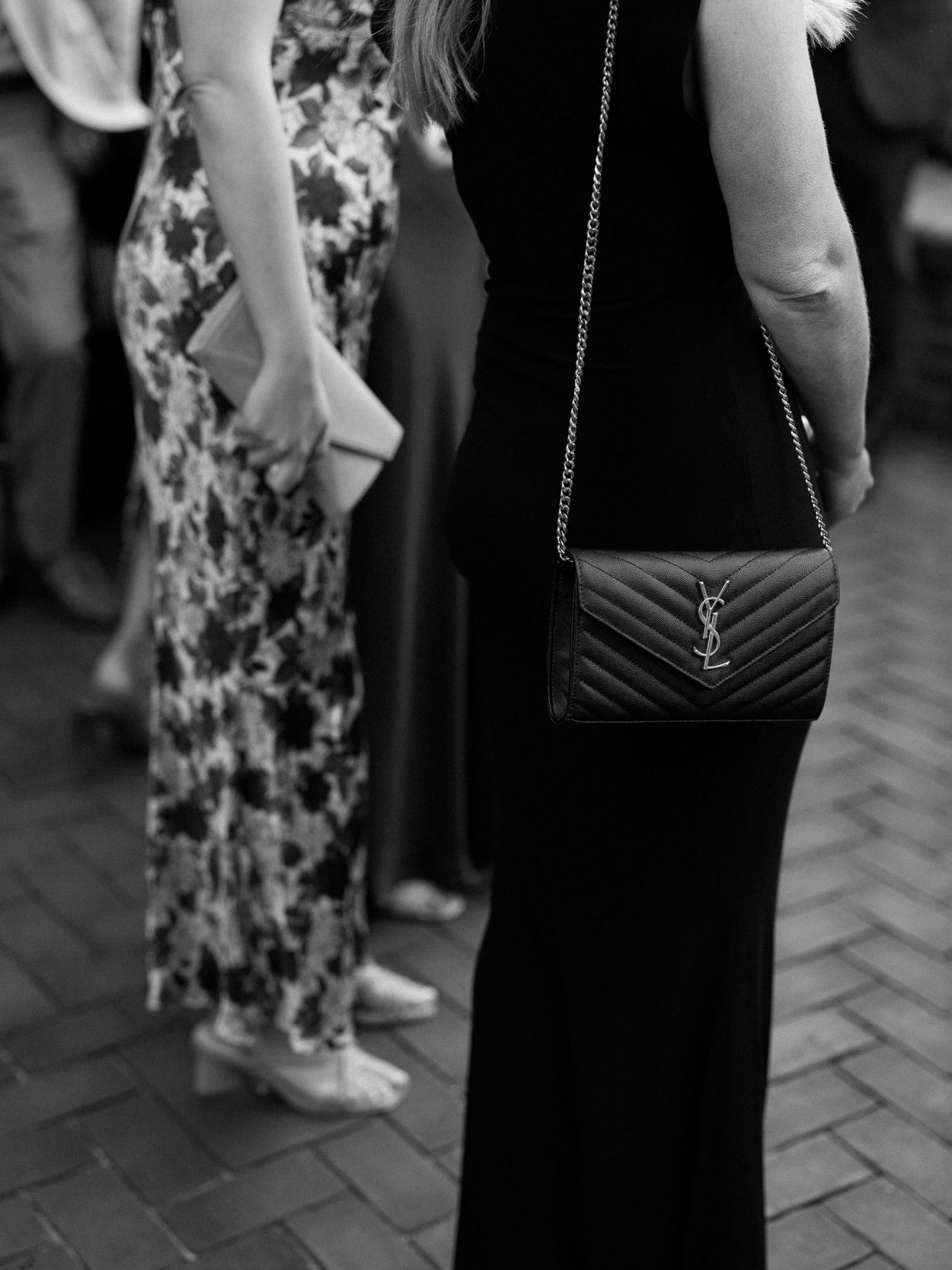 A stylish New York City wedding, rustic brick walls, velvet drapery, and golden candlelight, capturing the intimate, cinematic atmosphere of the iconic venue.