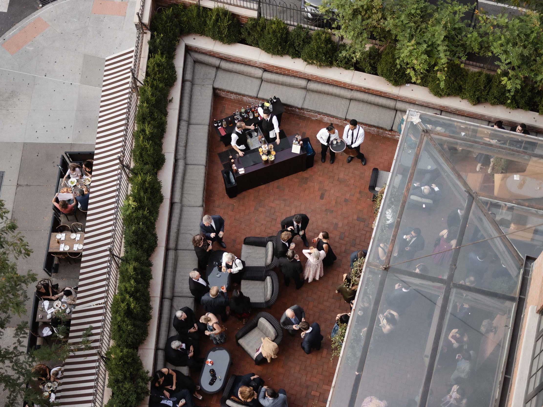 A stylish New York City wedding, rustic brick walls, velvet drapery, and golden candlelight, capturing the intimate, cinematic atmosphere of the iconic venue.