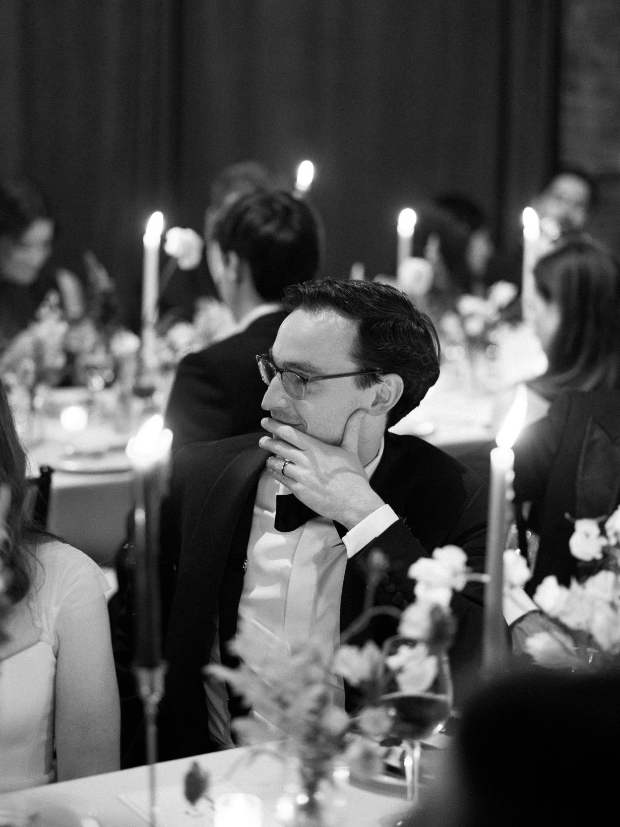 A stylish New York City wedding, rustic brick walls, velvet drapery, and golden candlelight, capturing the intimate, cinematic atmosphere of the iconic venue.