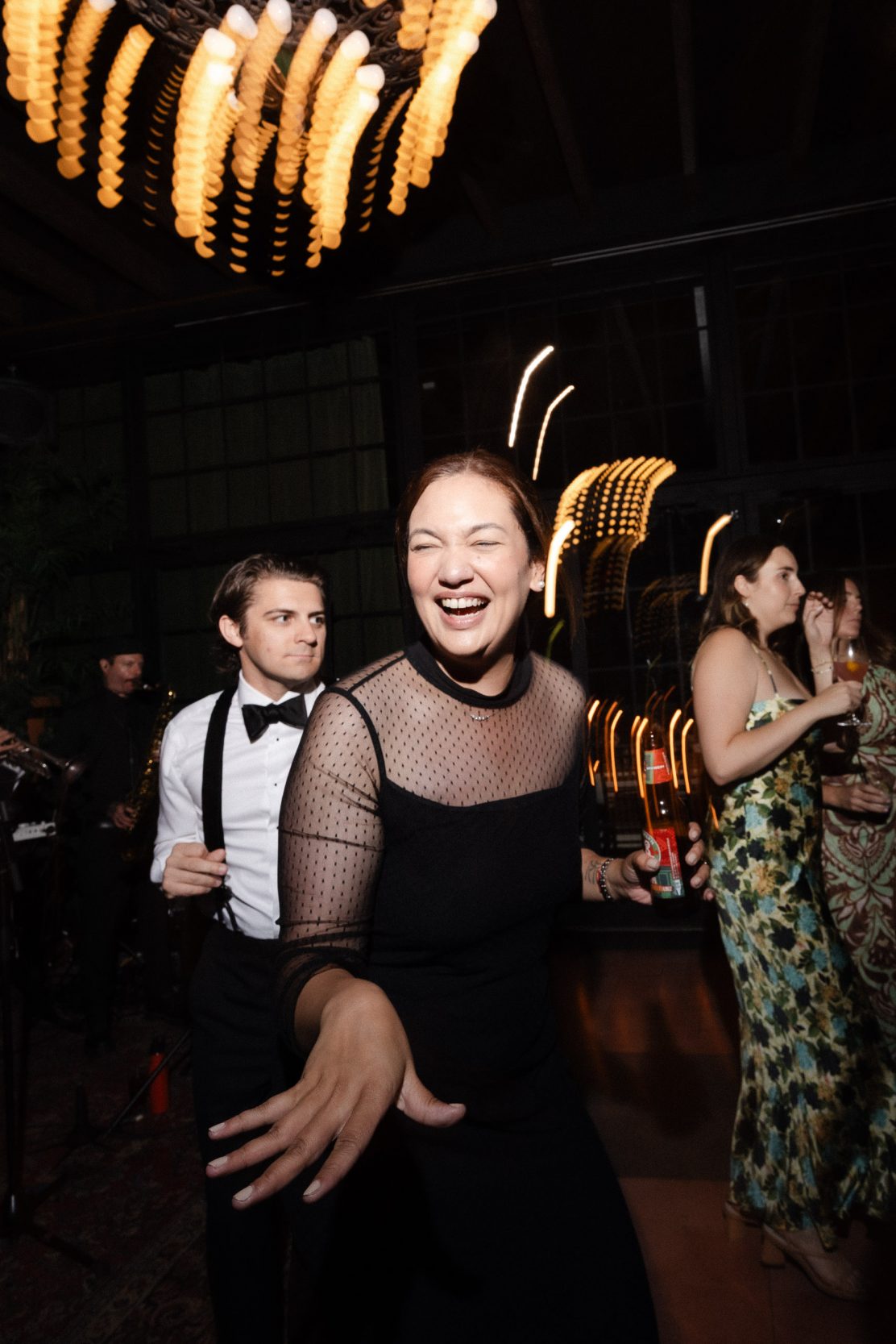 A stylish New York City wedding, rustic brick walls, velvet drapery, and golden candlelight, capturing the intimate, cinematic atmosphere of the iconic venue.